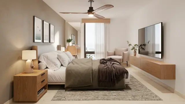 Recámaras de un departamento con cama, buró y ventanal